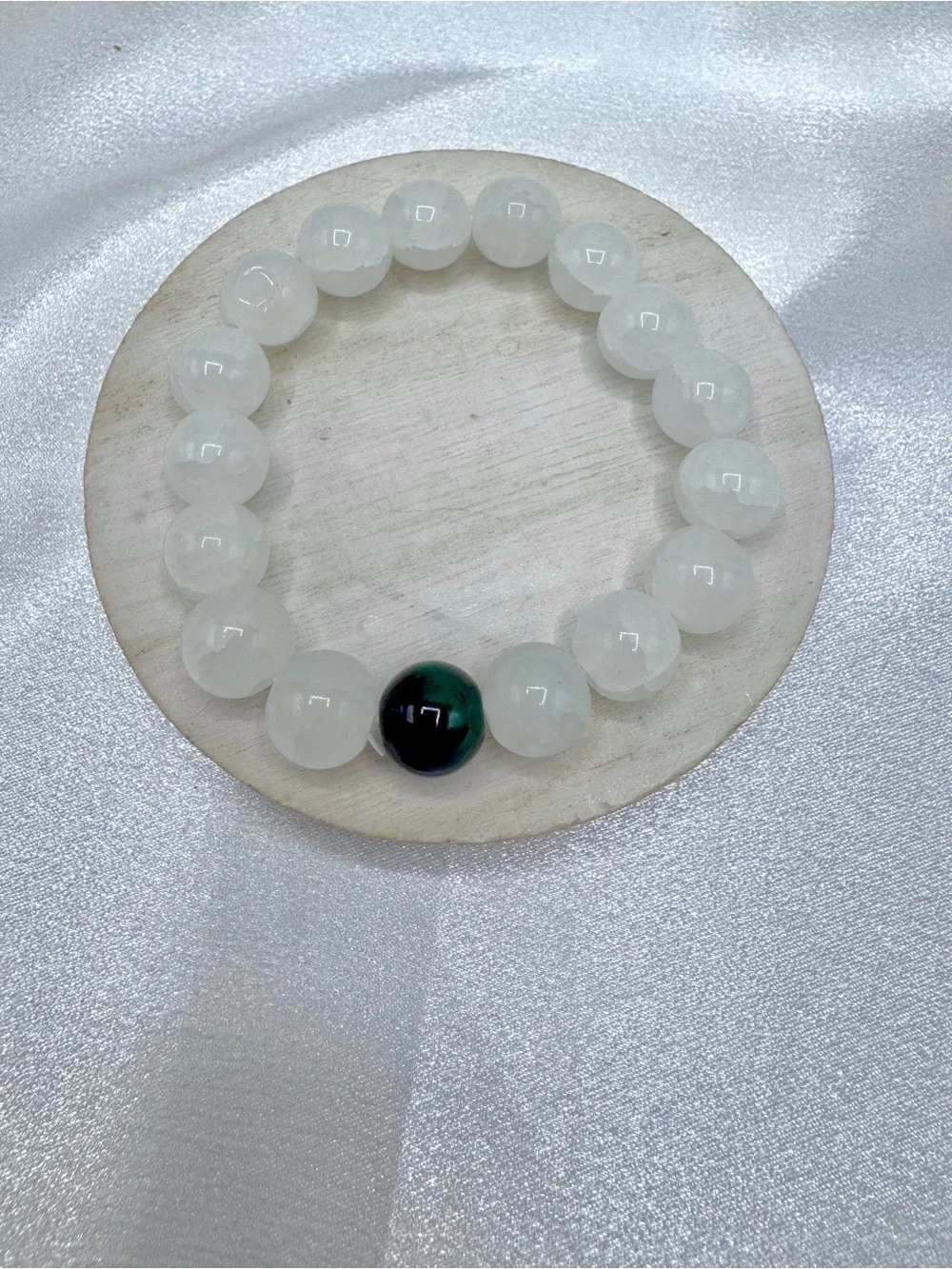 White Beaded Bracelet with Single Dark Accent Bead